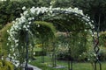 Rose arches along the garden path. Entrance to the rosarium Royalty Free Stock Photo