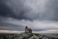 Rose Blanche Lighthouse, a large granite building on a cloudy day in Rose Blanche, Newfoundland Royalty Free Stock Photo