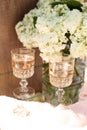 Rose blush wine in glasses. Bottle of rose wine with flowers on background. Prosecco Royalty Free Stock Photo