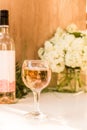 Rose blush wine in glasses. Bottle of rose wine with flowers on background. Prosecco Royalty Free Stock Photo