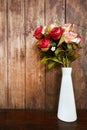 rose bouquet vase on wood table