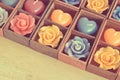 Rose candles and heart shape candles in wooden box