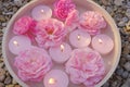 Rose candles.Pink burning candles and pink roses in water.Aromatherapy and spa.Candle flame. Candles background.Burning Royalty Free Stock Photo