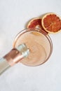 Rose champagne pouring into the vintage glass Royalty Free Stock Photo