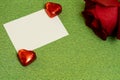 rose chocolates and card valentines day on green background Royalty Free Stock Photo