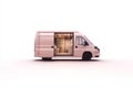 A rose-colored van with a bright interior. The sliding door is open, showing the inside of this customized, modern mobile home on Royalty Free Stock Photo