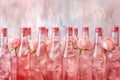 Rose essence bottles with fresh flowers Royalty Free Stock Photo