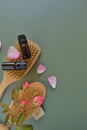 Rose essential oil .Aromatherapy and cosmetics. Glass bottles, flowers on green background.Organic natural rose oil Royalty Free Stock Photo