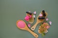 Rose essential oil and cosmetics salt with rose extract.Aromatherapy and cosmetics. Glass bottles,rose flowers and Royalty Free Stock Photo