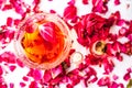 Rose face pack for dry skin isolated on white i.e. Rose petals well mixed with rose oil and glycerin in a glass bowl