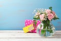 Rose flower bouquet in glass vase and gift box Royalty Free Stock Photo