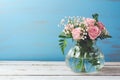 Rose flower bouquet in glass vase over wooden background Royalty Free Stock Photo