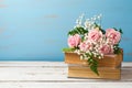 Rose flower bouquet on old books over wooden background Royalty Free Stock Photo