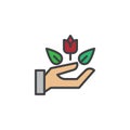 Rose flower in hand filled outline icon