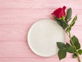 Rose flower, plate on wooden background rustic season design Royalty Free Stock Photo