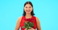Rose flowers, face and happy woman in studio, blue background and color backdrop. Portrait of female model, plant Royalty Free Stock Photo