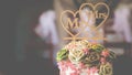 Rose flowers on wedding cake for the bride and groom couple cut in the wedding party event at a restaurant or church Royalty Free Stock Photo