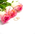Rose flowers and wedding rings selective focus Royalty Free Stock Photo