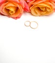 Rose flowers and wedding rings selective focus Royalty Free Stock Photo