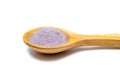 Image of Rose food coloring powder in wooden spoon on white background Royalty Free Stock Photo