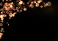 Rose and gold Christmas or new year bokeh lights on a black background Royalty Free Stock Photo