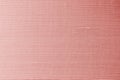 Rose gold pink background of silk fabric satin texture cotton cloth pattern with shiny gradient silky woven detail Royalty Free Stock Photo