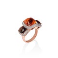 Rose gold ring with brown saphires and multiple diamonds, cushion cut gems Royalty Free Stock Photo