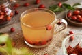 Rose hip tea in a glass cup with fresh berries Royalty Free Stock Photo