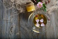 Rose hip tea in a glass cup on a wooden surface. Royalty Free Stock Photo