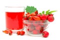 Rose hips, hawthorn and drink on a white Royalty Free Stock Photo