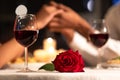 Rose Lying On Table, Loving Couple Holding Hands In Restaurant Royalty Free Stock Photo