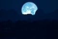 rose moon on night sky back over silhouette mountain Royalty Free Stock Photo