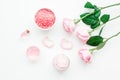 Rose organic cosmetics with salt, cream and oil on white table background top view mock up