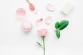 rose organic cosmetics with salt, cream and oil on white table background top view mock up