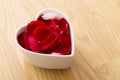 Rose petal flower in heart bowl