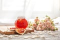 Rose petal jam and heart shaped sandwich with marmalade rose flower on table