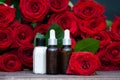 Rose Petal oil and cream in bottles and fresh