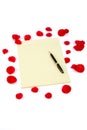 Rose petals and letter paper Royalty Free Stock Photo