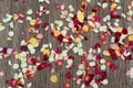 Rose petals lie on the floor. Wooden boards, flower petals - red, pink and white Royalty Free Stock Photo