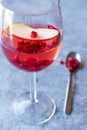 Rose Pink Blush Wine Cocktail with Pomegranate Seeds, Apple Slice and Crushed Ice. Royalty Free Stock Photo