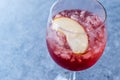 Rose Pink Blush Wine Cocktail with Pomegranate Seeds, Apple Slice and Crushed Ice. Royalty Free Stock Photo