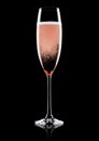 Rose pink champagne glass with bubbles on black Royalty Free Stock Photo