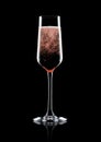 Rose pink champagne glass with bubbles on black Royalty Free Stock Photo