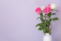 Rose placed on the desk in blue background Royalty Free Stock Photo