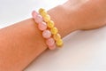 Rose quartz and golden rutilated quartz bracelets. Royalty Free Stock Photo