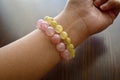 Rose quartz and golden rutilated quartz bracelets. Royalty Free Stock Photo