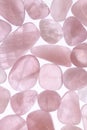 Rose quartz jewel heap texture on light surface. Royalty Free Stock Photo
