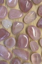 Rose quartz rare jewel on light varnished wood texture