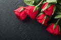 Rose red flowers, brownie cookies and chocolate candy on heart shaped, gift box with wine on black background. Valentines day, Mot Royalty Free Stock Photo