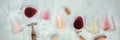 Rose, red, and white wine, with corscrews and corks, shot from above Royalty Free Stock Photo